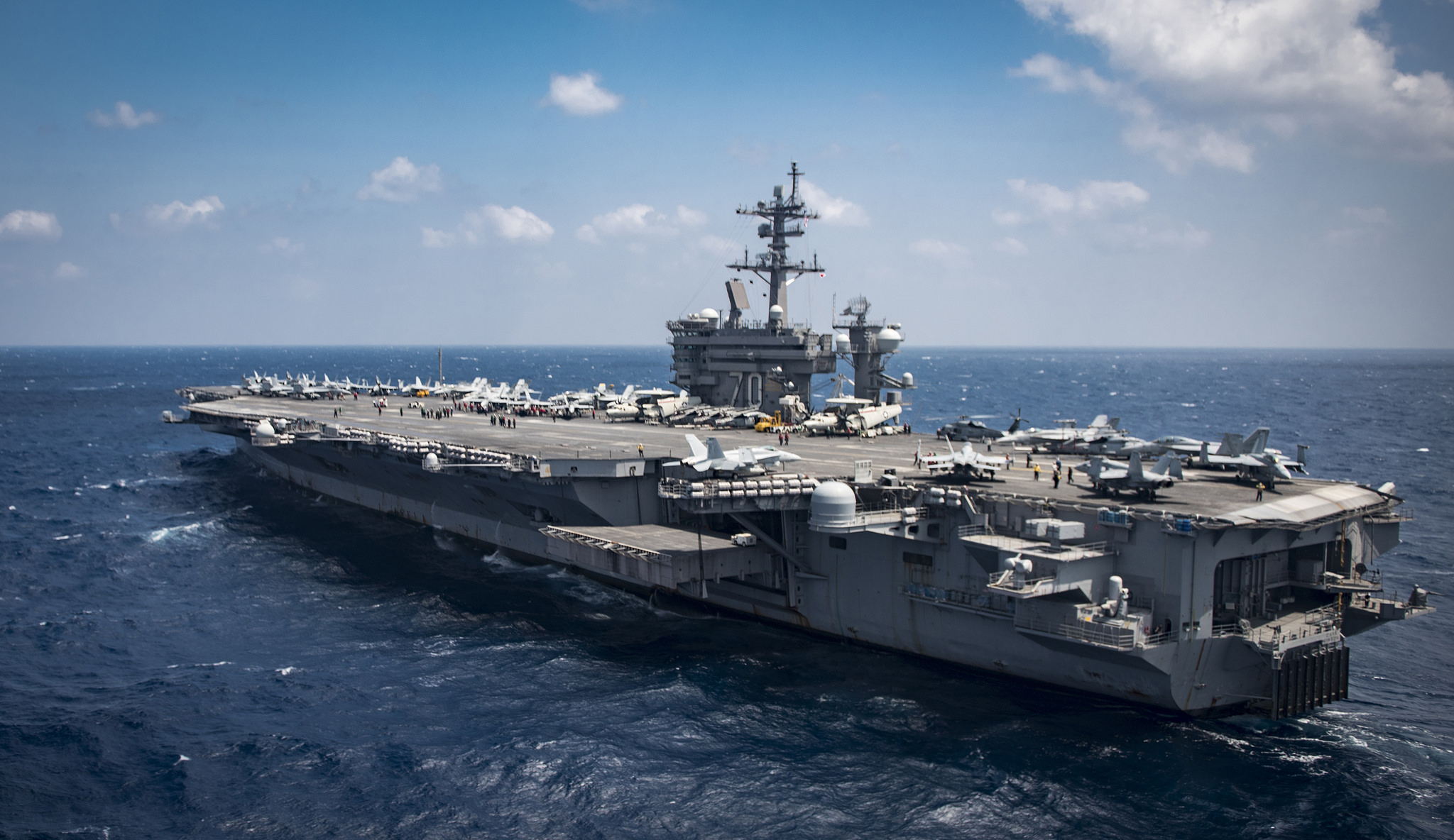 The aircraft carrier USS Carl Vinson transits the South China Sea. The ship and its carrier strike group are on a western Pacific deployment as part of the U.S. Pacific Fleet-led initiative to extend the command and control functions of U.S. 3rd Fleet.